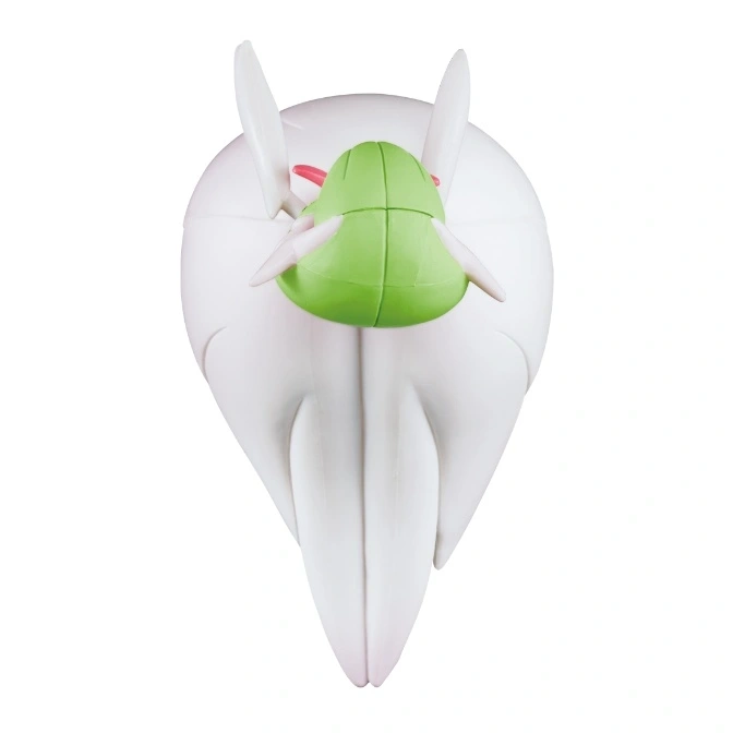  White and green Gardevoir toy figure, viewed from above, showing head and back details.
