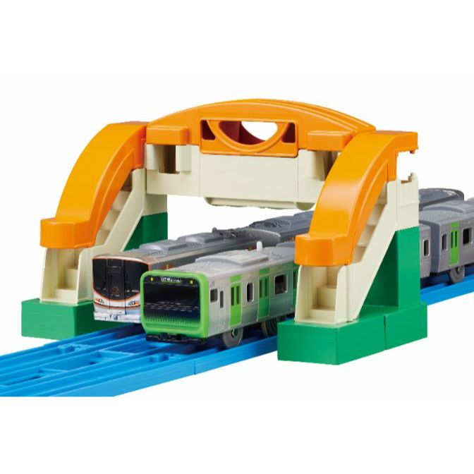  Toy train set with a bridge and two trains.