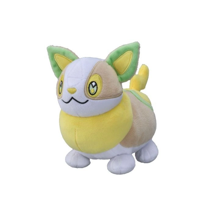 Plush Fidough Pokémon toy with yellow, white, and brown fur, standing.