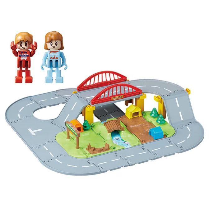 Toy road playset with bridge, figures, trees, and buildings for imaginative play.