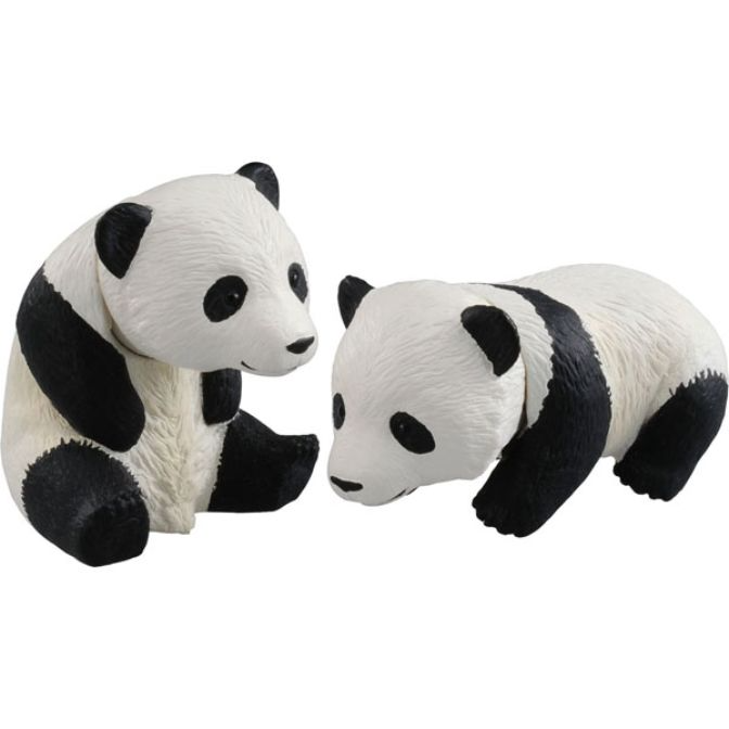 Two panda bear figurines, one sitting and one lying down, both black and white.