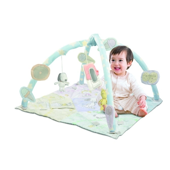  Baby playing in Snoopy-themed activity gym with hanging toys.