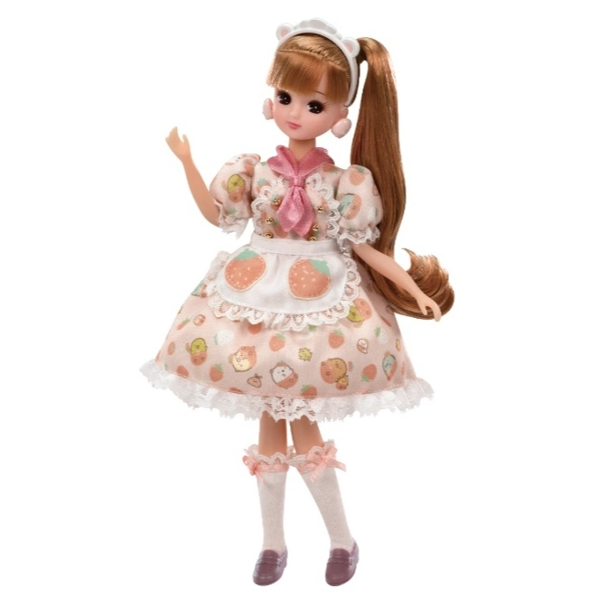 Licca-chan doll in a strawberry-themed dress with apron, headband, and knee-high socks.