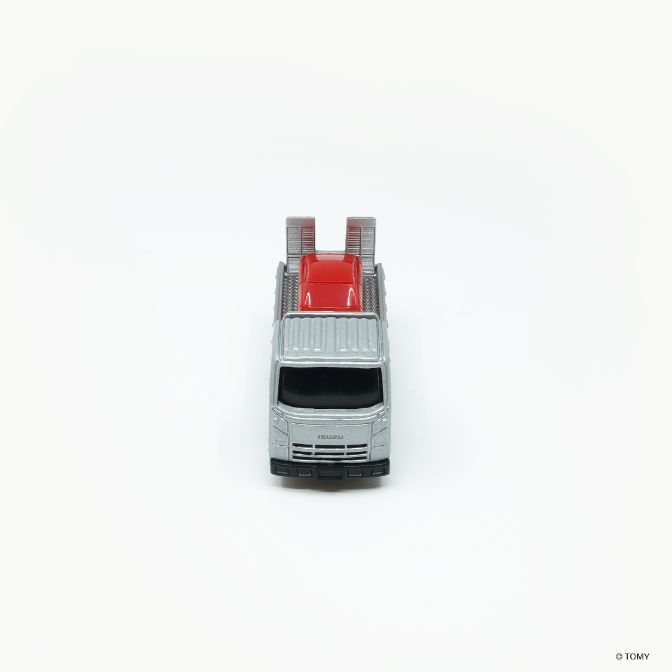  Silver Isuzu car carrier toy with a red car on its back.
