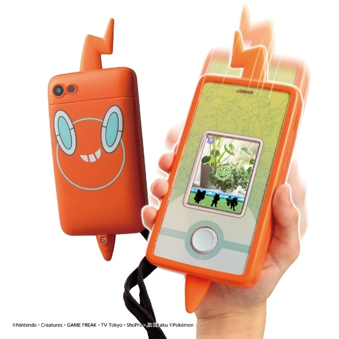 Rotom Phone toy with screen showing Pokémon silhouettes and an orange case with a Rotom face.
