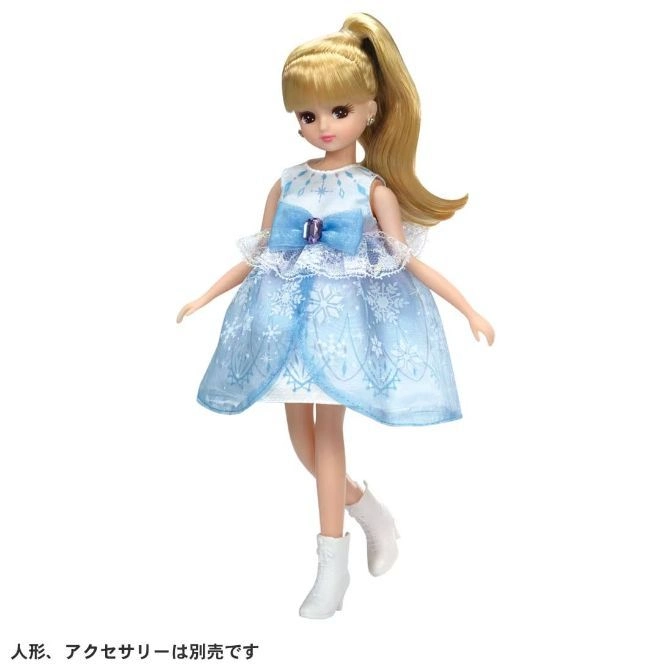  Doll with blonde hair in a ponytail, wearing a blue snowflake dress and white boots.