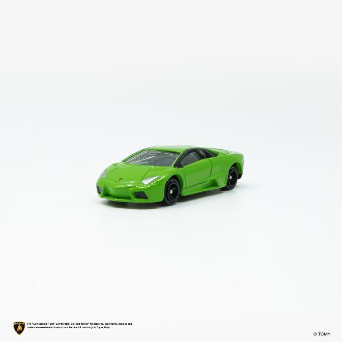  Green toy Lamborghini with black wheels on a white background.