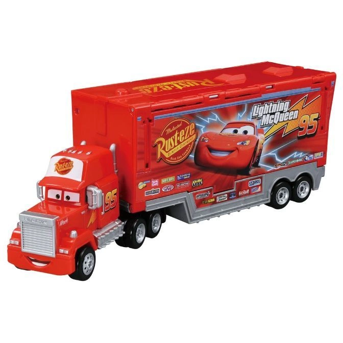 Red Mack truck toy with Lightning McQueen design on trailer.