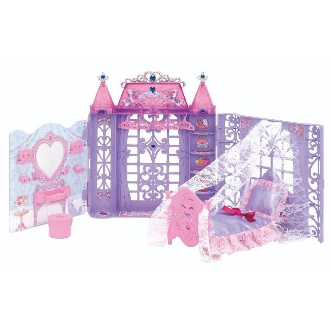 Pink and purple dollhouse with furniture, including a bed, vanity, and wardrobe.