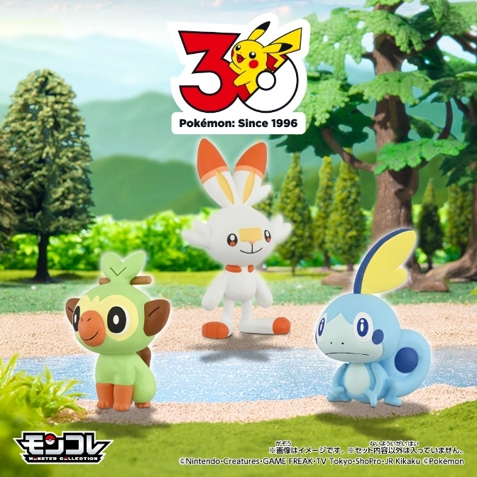  Pokémon starter toys Grookey, Scorbunny, and Sobble in a grassy, outdoor setting with a 30th anniversary logo.