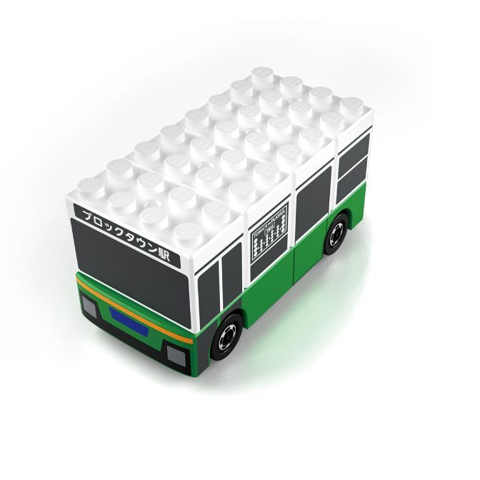 Toy bus made of building blocks, white roof, green and black body, with Japanese text on the front.