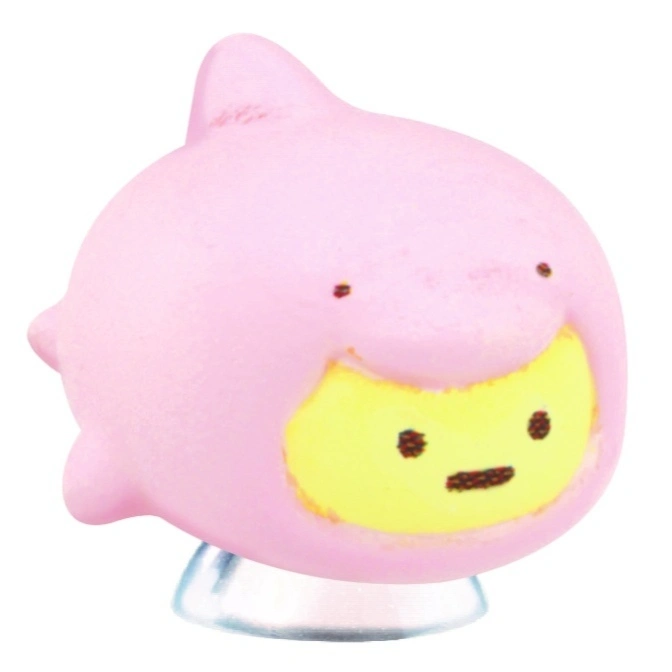  Pink dolphin toy with a yellow face and a simple, cute expression.