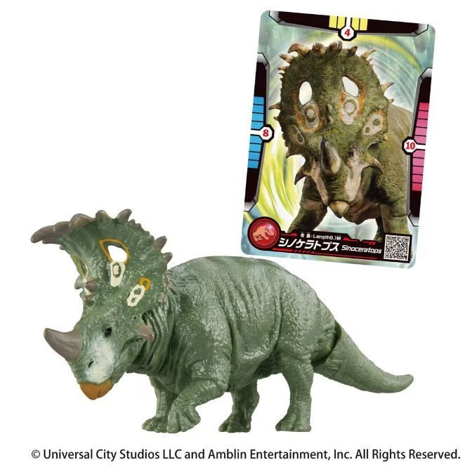 Green Sinoceratops toy with frill holes, next to its trading card showing the dinosaur.
