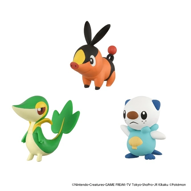  Three Pokémon figures: Tepig, Snivy, and Oshawott, standing on a white surface.