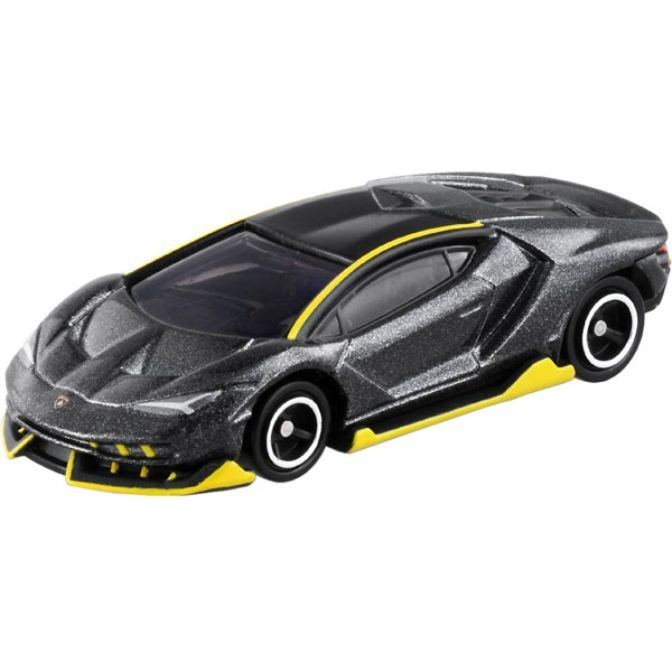 Black and yellow toy Lamborghini Centenario with detailed design and white-rimmed wheels.