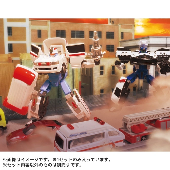  Transformer toys: ambulance robot with gun, police car robot, and emergency vehicles in a city setting.