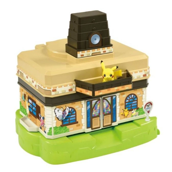  Pokémon Center toy building with Pikachu figure on balcony, brown tower on top, and green base.