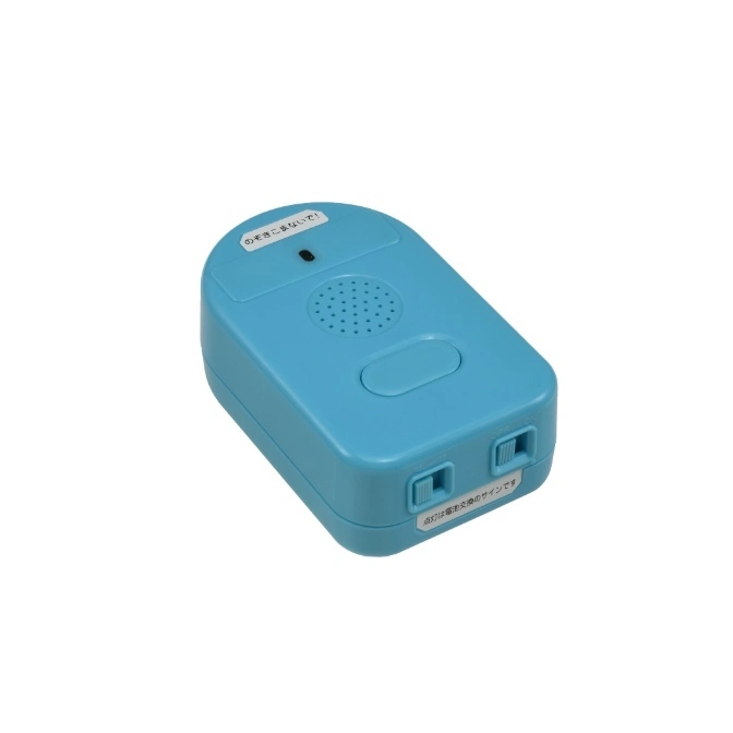  Blue toy with speaker, button, and switches. Stickers with Japanese text are visible.