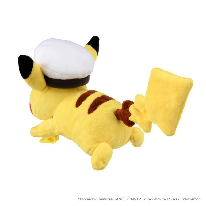  Pikachu plush wearing a white sailor hat, lying on its side.