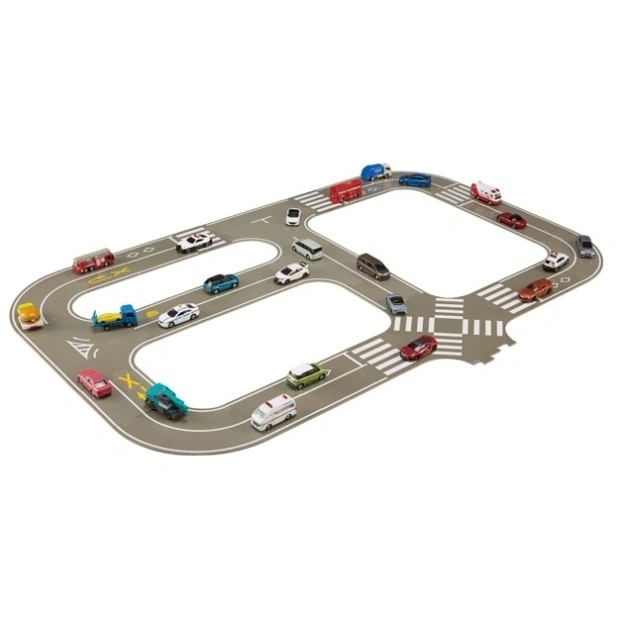 Toy car track with miniature vehicles including cars, trucks, and emergency vehicles on a gray road with crosswalks.