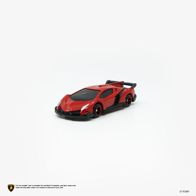  Red toy Lamborghini Veneno with black accents and spoiler on a white background.