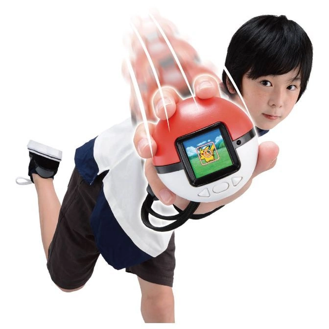  Boy throwing a Pokémon Poké Ball toy with a screen showing Pikachu.