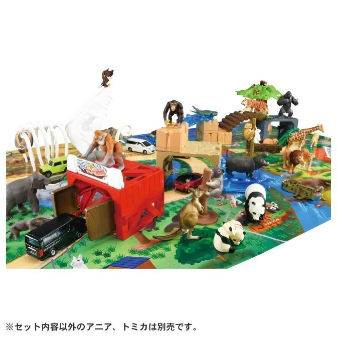  Animal playset with toy cars, figures of animals like lions, pandas, and a kangaroo, and a red barn.