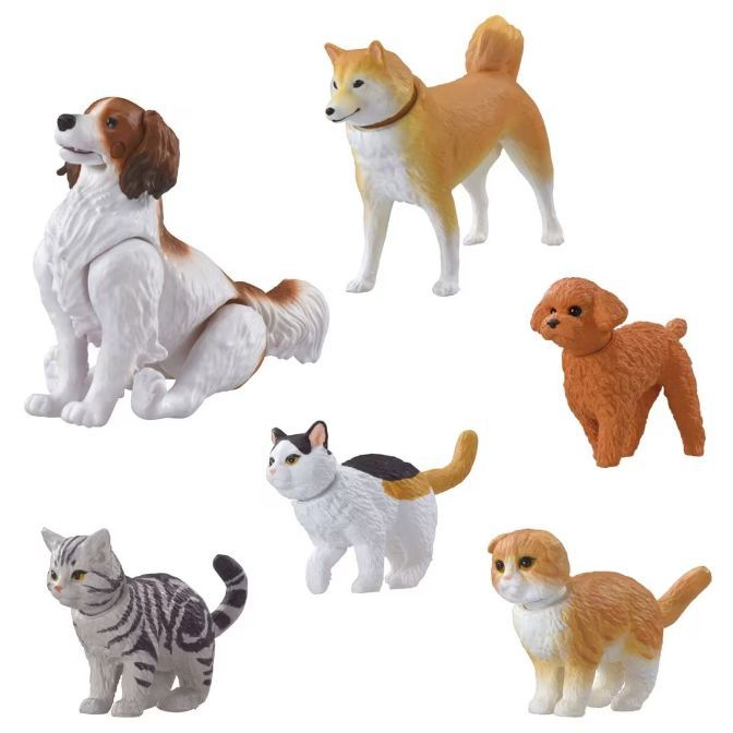 Toy figurines of dogs and cats: spaniel, Shiba Inu, poodle, tabby, calico, and ginger kitten.