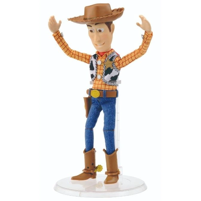  Toy Story Woody doll with hat, vest, jeans, boots, and arms raised.