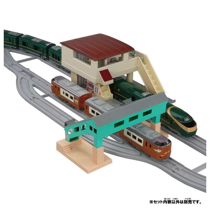  A toy train set with a station and several trains.