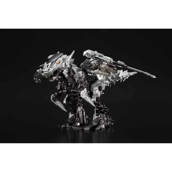 Silver and black Zoids toy with a long cannon on its back, standing on a black surface.