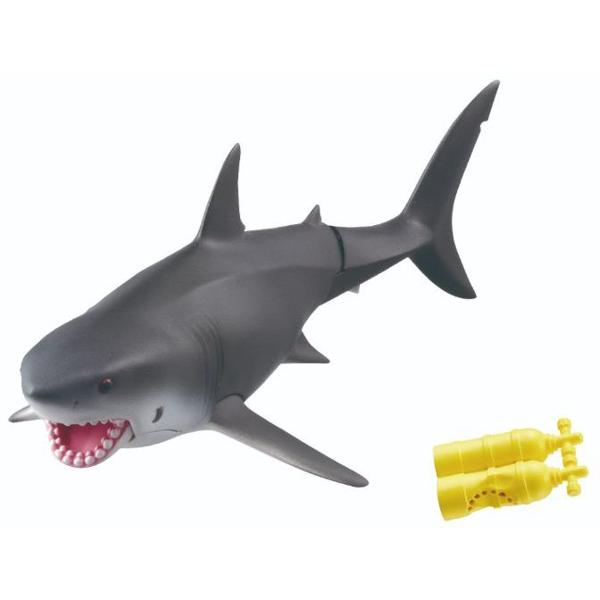 Grey toy shark with pink teeth and yellow scuba tanks.