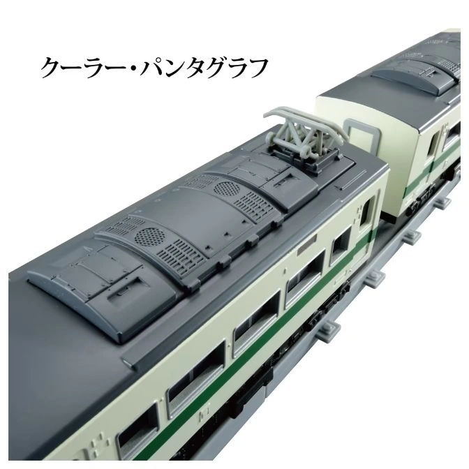 Toy train with gray roof, green stripe, and pantograph on top.