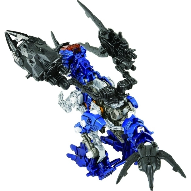  Blue and silver robot toy with black weapons attached to its arms and legs.