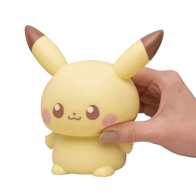  Pikachu-shaped nightlight with brown-tipped ears being held by a hand.