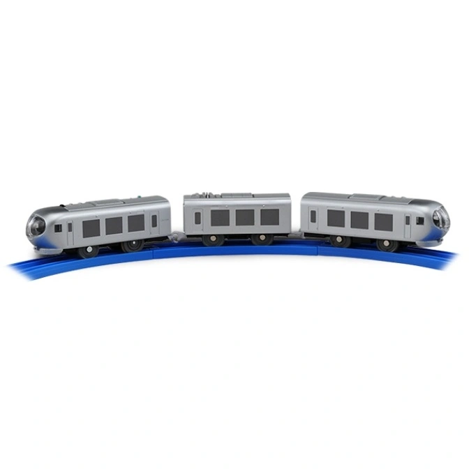  Silver toy train on blue track. Three cars with rounded ends and dark windows.