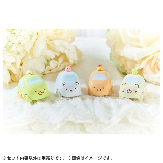  Four Sumikko Gurashi character cars: green, blue, orange, and white, each with a tiny figure on top.