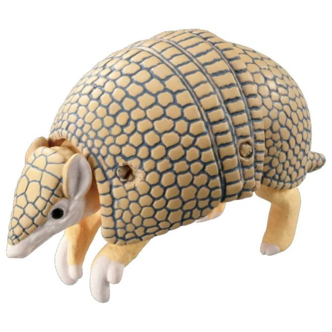 Armadillo toy with segmented shell, small eyes, and light yellow coloring.