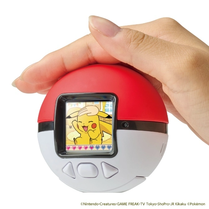  Pokémon Poké Ball virtual pet toy with Pikachu on screen, held in hand.