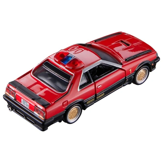  Red toy police car with gold rims and a light bar on top.