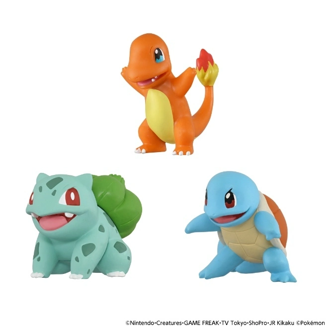  Three Pokémon figurines: Charmander, Bulbasaur, and Squirtle.