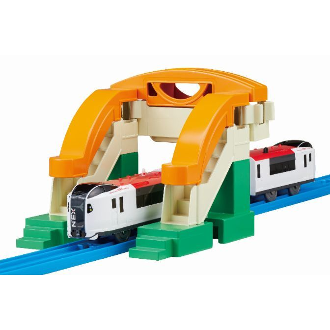 A toy train set with a bridge and two trains.