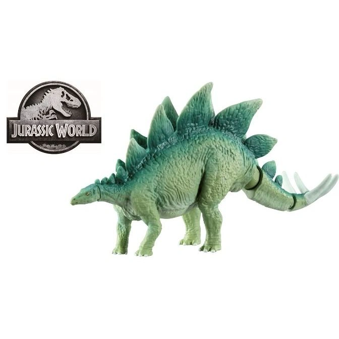 Green Stegosaurus toy with plates on its back and spikes on its tail, next to Jurassic World logo.