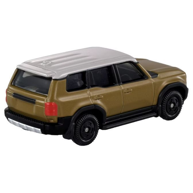  Toy SUV with a tan body and a silver roof, showcasing its rear design.