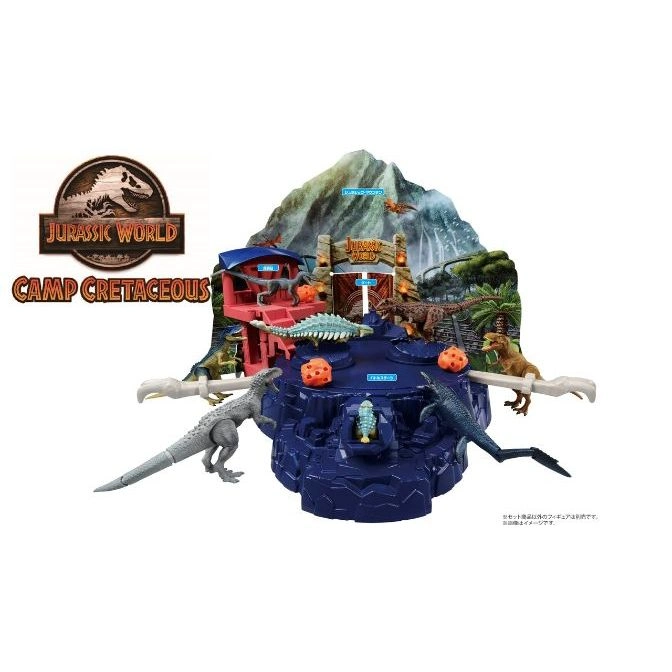 Jurassic World Camp Cretaceous playset with dinosaurs, tower, and mountain backdrop.