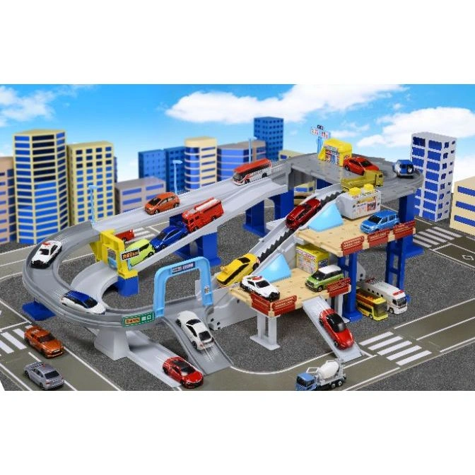  Toy car playset with elevated tracks, buildings, and various miniature vehicles.