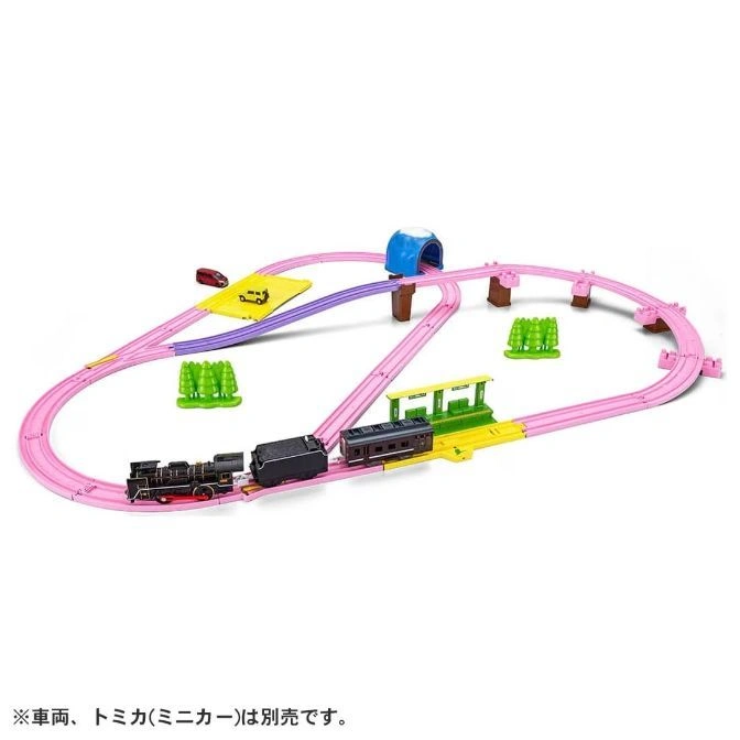  Toy train set with pink tracks, a black steam engine, tunnel, station, and miniature cars.