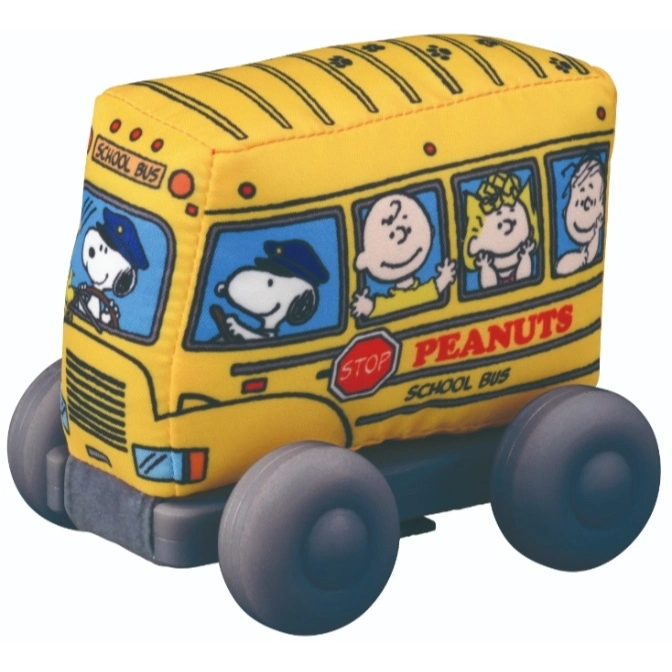 Plush Peanuts school bus toy with Snoopy driving and other characters as passengers.