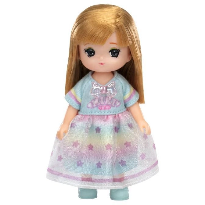 Doll with blonde hair wearing a blue top and star-patterned dress.