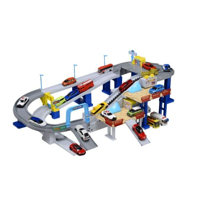 Toy car playset with ramps, roads, and miniature vehicles, including cars, buses, and emergency vehicles.